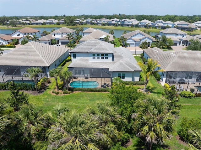 aerial view featuring a residential view and a water view