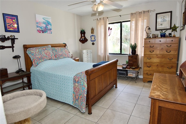 bedroom with a ceiling fan and light tile patterned floors