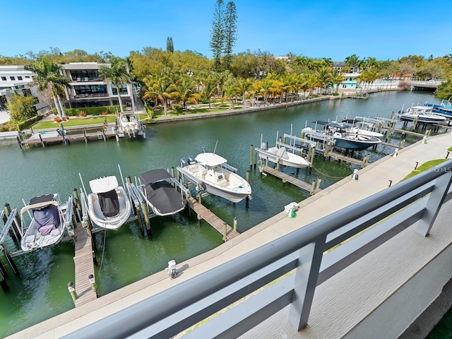 view of dock with boat lift and a water view