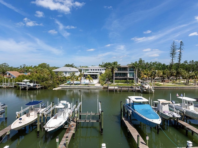 dock area with a water view and boat lift