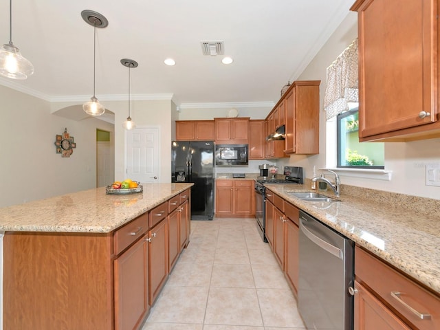 5952 Snowy Egret Dr, Sarasota, FL 34238 - kitchen featuring visible vents, a center island, a sink, ornamental molding, and black appliances