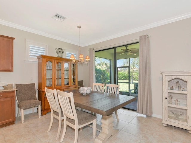 5952 Snowy Egret Dr, Sarasota, FL 34238 - dining area with crown molding, visible vents, a chandelier, and light tile patterned floors
