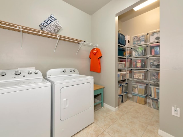 5952 Snowy Egret Dr, Sarasota, FL 34238 - washroom with washing machine and clothes dryer, baseboards, and tile patterned flooring