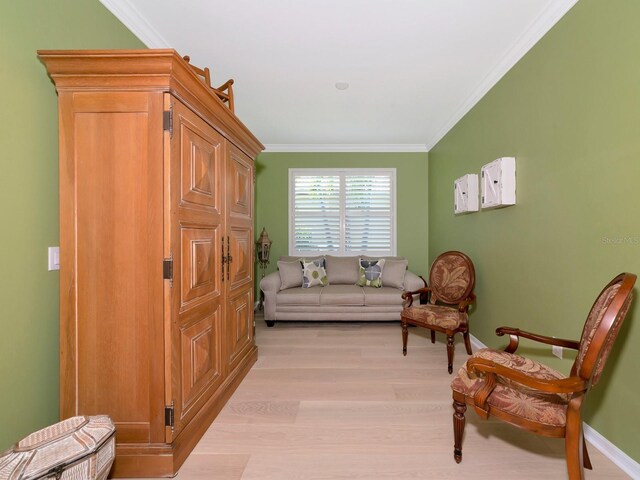 5952 Snowy Egret Dr, Sarasota, FL 34238 - living area with baseboards, light wood-type flooring, and ornamental molding