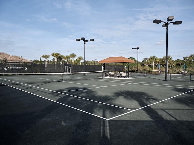 5952 Snowy Egret Dr, Sarasota, FL 34238 - view of tennis court featuring fence