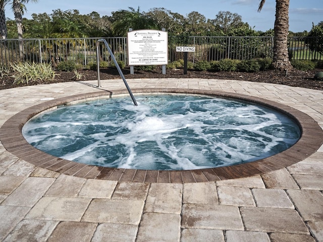5952 Snowy Egret Dr, Sarasota, FL 34238 - view of swimming pool with a community hot tub and fence