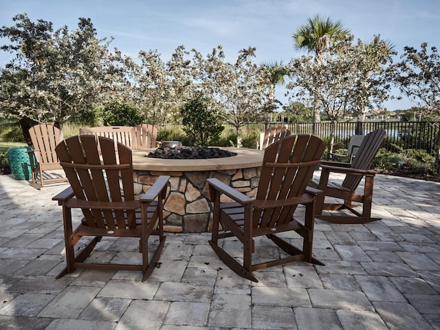 5952 Snowy Egret Dr, Sarasota, FL 34238 - view of patio with a fenced backyard and a fire pit