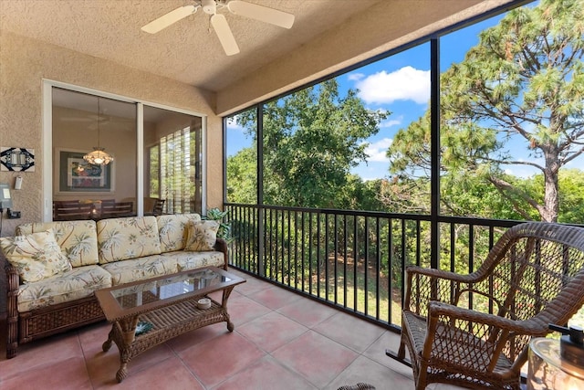 sunroom / solarium with a ceiling fan and an outdoor hangout area