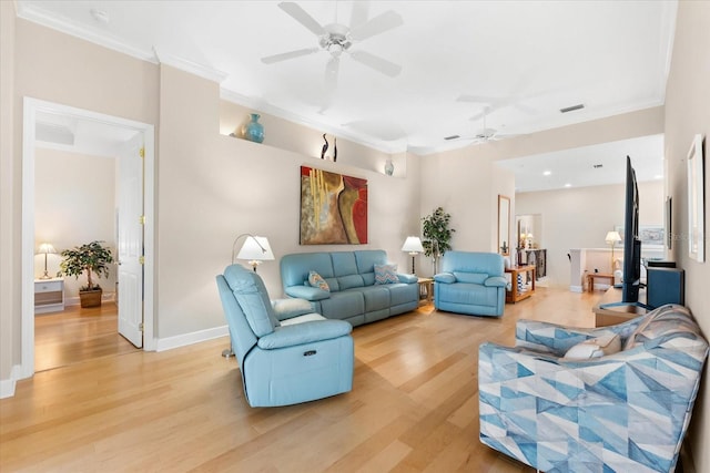living area featuring visible vents, ornamental molding, a ceiling fan, and light wood-style floors
