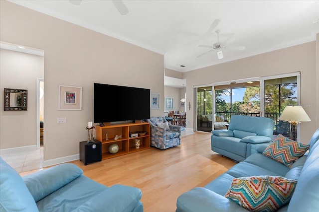 living area featuring light wood-style flooring, baseboards, and ceiling fan
