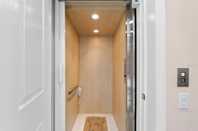 interior details featuring recessed lighting and elevator