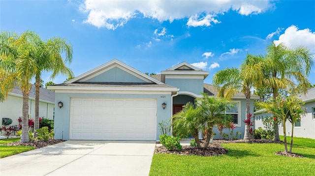 4325 Renwick Dr, Parrish, FL 34219 - ranch-style home featuring stucco siding, a front yard, concrete driveway, and an attached garage