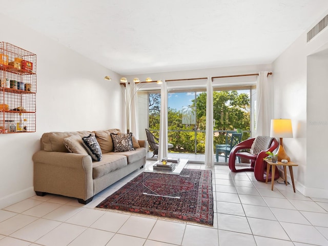 living area featuring visible vents, baseboards, and tile patterned flooring