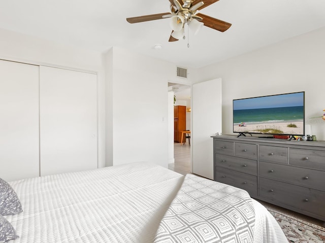 bedroom featuring a closet, a ceiling fan, and visible vents