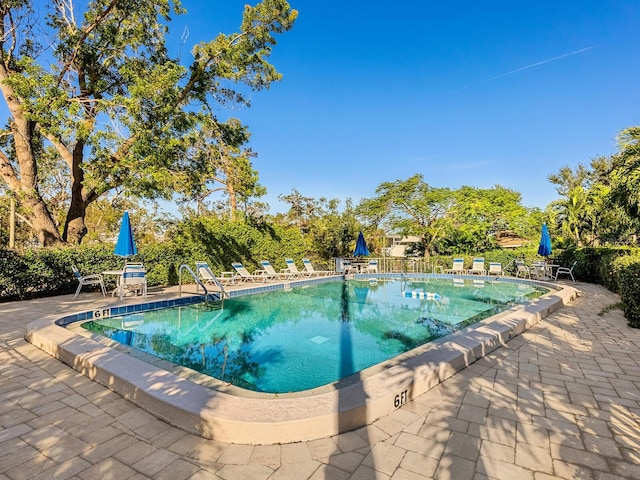 pool with a patio area