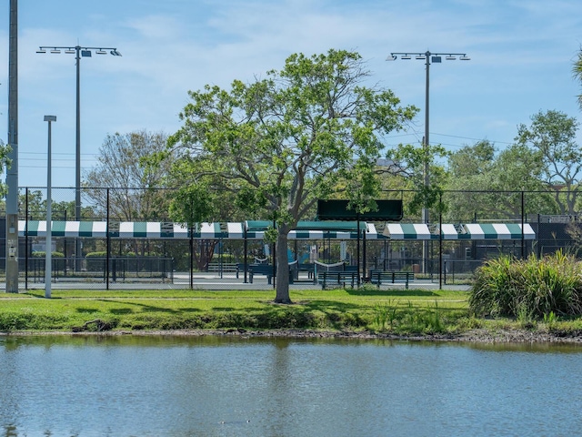 property view of water featuring fence