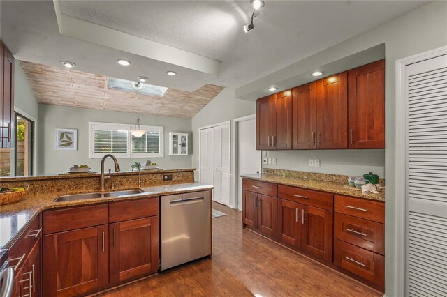 kitchen with light stone counters, a sink, dark wood finished floors, and dishwasher