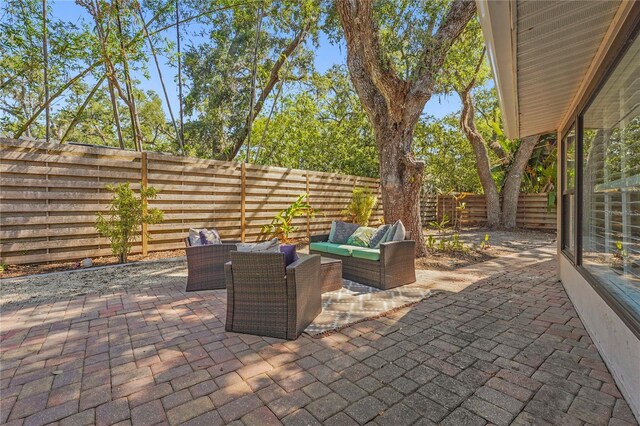 view of patio / terrace with an outdoor hangout area and a fenced backyard