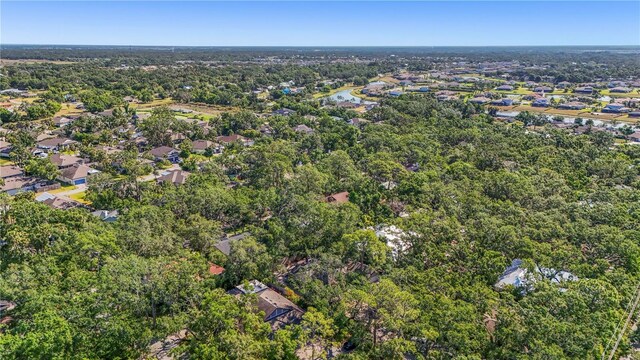 bird's eye view featuring a water view, a view of trees, and a residential view