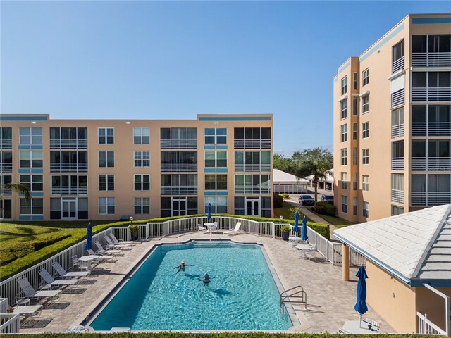 4570 Pinebrook Cir Unit 406, Bradenton, FL 34209 - pool featuring fence and a patio area