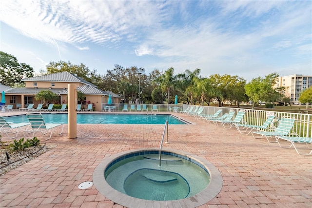 4570 Pinebrook Cir Unit 406, Bradenton, FL 34209 - pool featuring fence, a patio, and a hot tub