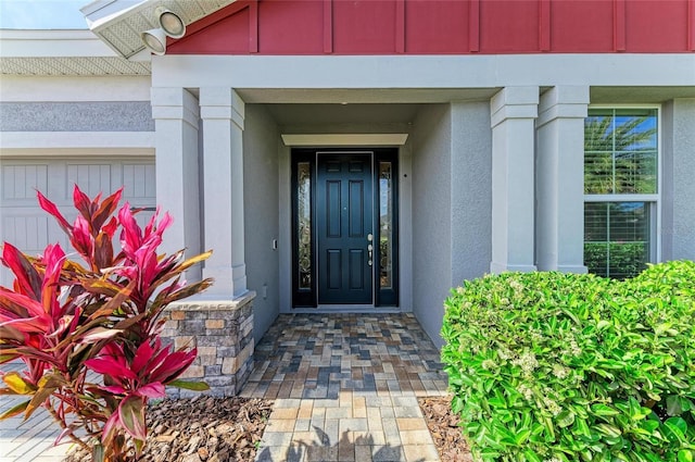 doorway to property with stucco siding
