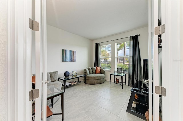 sitting room with light tile patterned floors