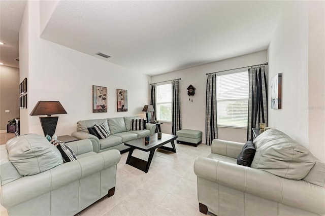 living room with visible vents and light tile patterned flooring