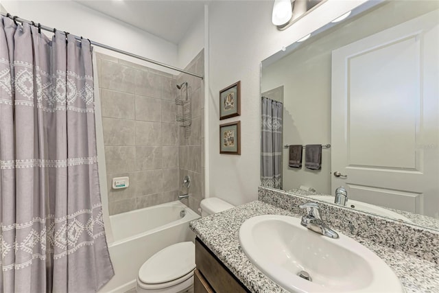 bathroom with shower / tub combo with curtain, vanity, and toilet