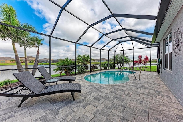 pool featuring a patio area and glass enclosure