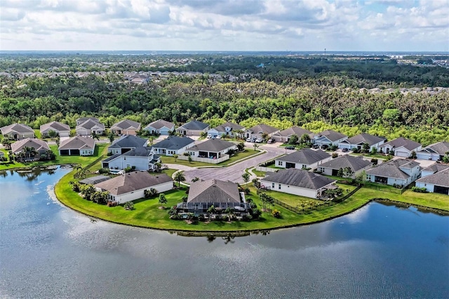 birds eye view of property with a water view and a residential view
