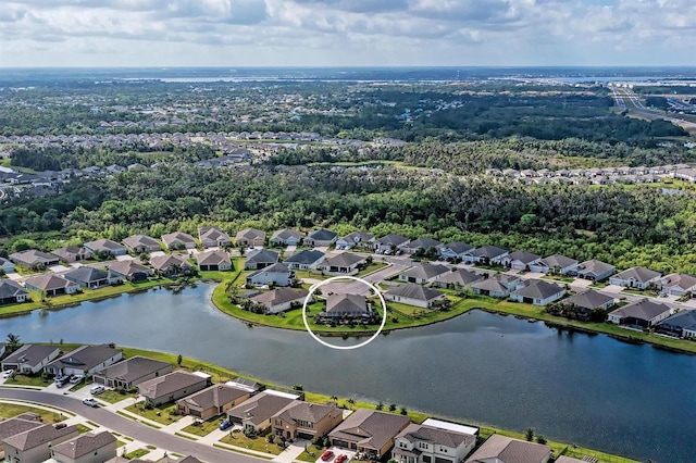 aerial view with a residential view and a water view