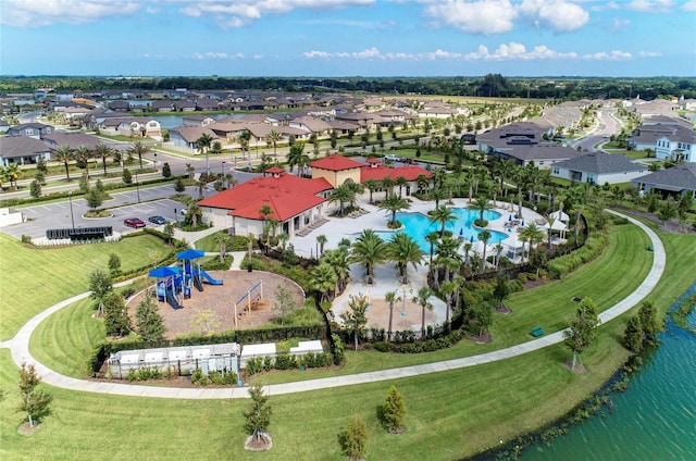 bird's eye view with a water view and a residential view