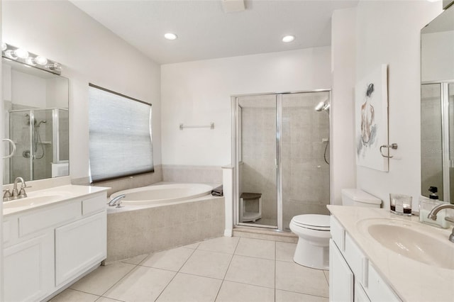 full bath with a sink, tile patterned flooring, and a shower stall