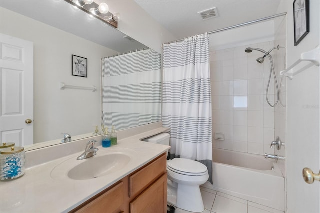 bathroom with visible vents, tile patterned flooring, shower / bath combo, vanity, and toilet