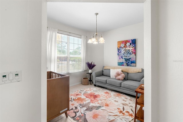 living area with baseboards, light tile patterned floors, and a notable chandelier