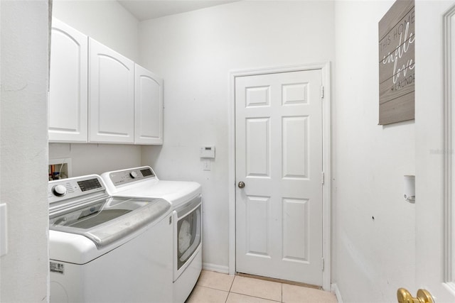 washroom with separate washer and dryer, baseboards, cabinet space, and light tile patterned floors