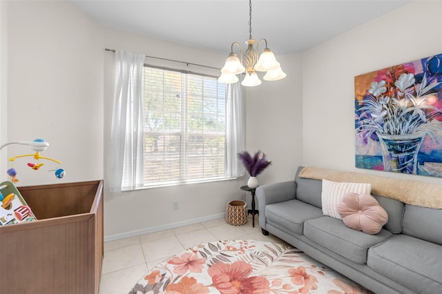 living area with light tile patterned floors, baseboards, a notable chandelier, and a healthy amount of sunlight