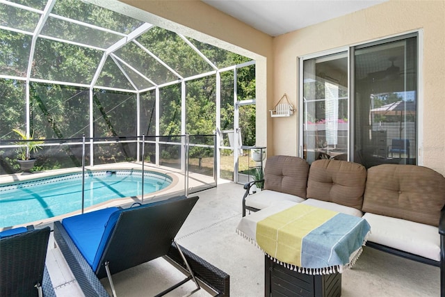 pool with glass enclosure, outdoor lounge area, and a patio area