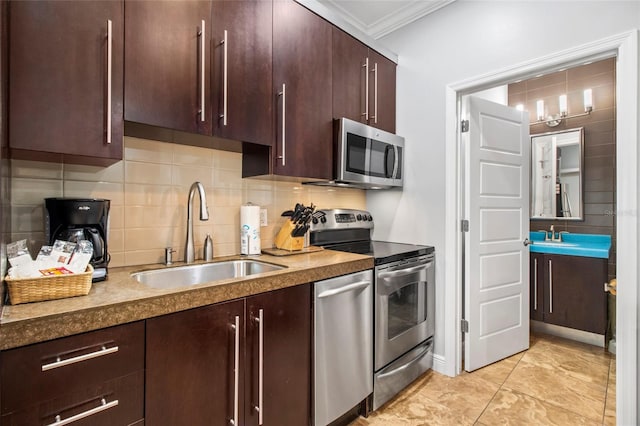 1020 Sun N Sea Dr Unit 104B, Sarasota, FL 34242 - kitchen with a sink, decorative backsplash, dark brown cabinetry, ornamental molding, and appliances with stainless steel finishes