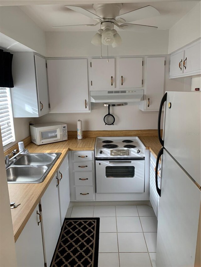 4502 3rd Street Cir W Unit 242, Bradenton, FL 34207 - kitchen with a ceiling fan, a sink, white appliances, under cabinet range hood, and light countertops