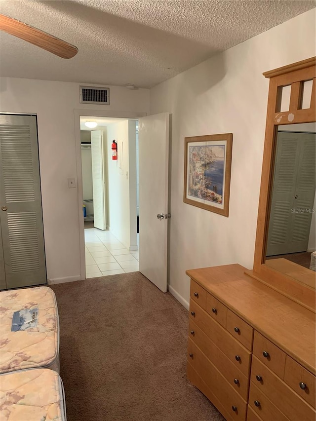 4502 3rd Street Cir W Unit 242, Bradenton, FL 34207 - interior space with light carpet, a textured ceiling, baseboards, and visible vents