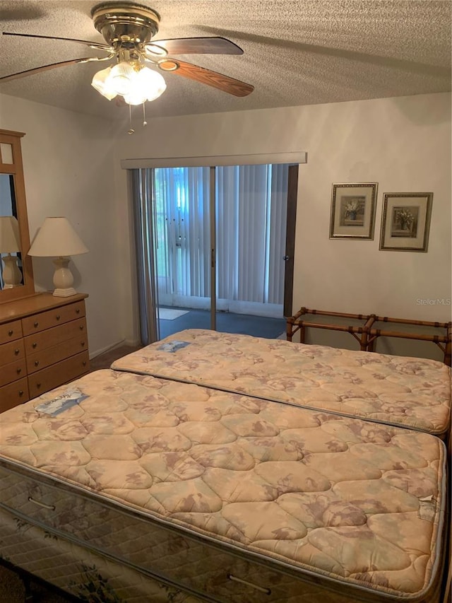 4502 3rd Street Cir W Unit 242, Bradenton, FL 34207 - bedroom with a textured ceiling and a ceiling fan