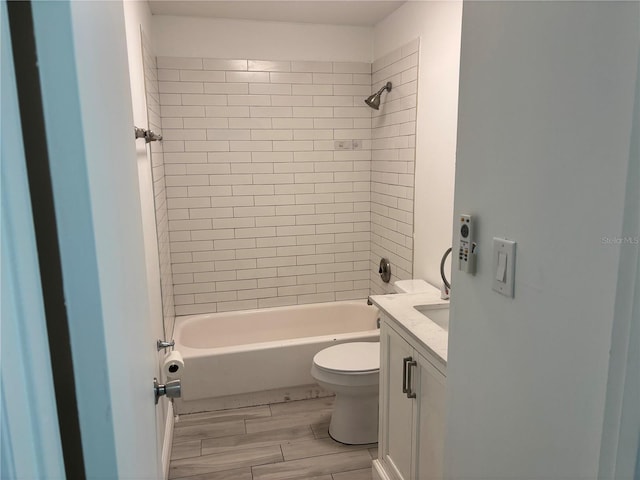full bath featuring vanity, toilet, wood finished floors, and shower / bathing tub combination