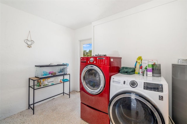 laundry room featuring washer and clothes dryer and laundry area