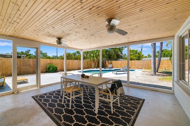 sunroom featuring a ceiling fan and a healthy amount of sunlight