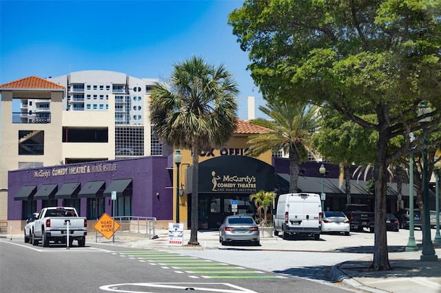 view of building exterior featuring uncovered parking