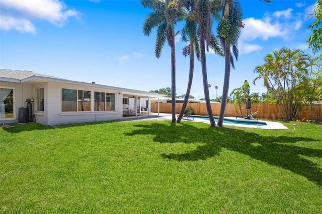 view of yard featuring a fenced backyard, a patio area, and a fenced in pool
