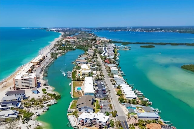 birds eye view of property featuring a view of the beach and a water view
