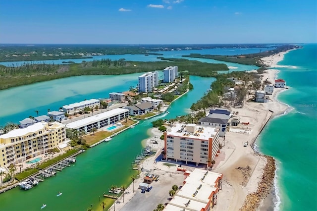 drone / aerial view featuring a view of the beach and a water view
